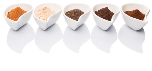 Cocoa powder, dried tea leaves and grounded coffee in ceramic