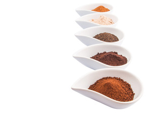 Cocoa powder, dried tea leaves and grounded coffee in ceramic