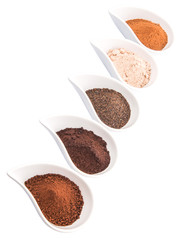 Cocoa powder, dried tea leaves and grounded coffee in ceramic