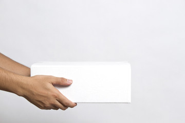 Hand of man, stretching out his hand to give the parcels boxes