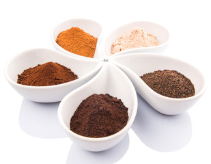 Cocoa powder, dried tea leaves and grounded coffee in ceramic
