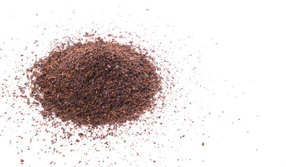 Dried tea leaves over white background