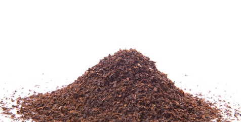 Dried tea leaves over white background