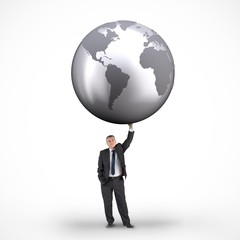 Composite image of businessman holding globe
