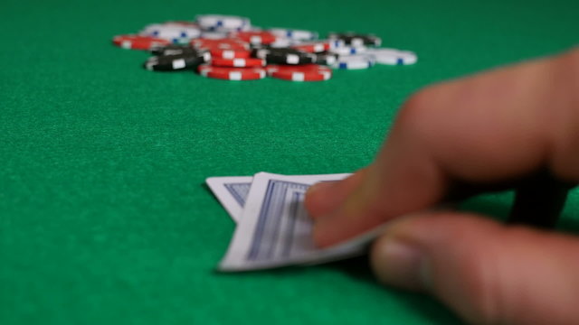 Poker Player with Pocket Aces Considering His Move