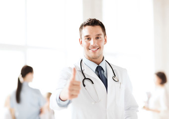 doctor with stethoscope showing thumbs up