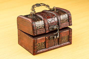 ancient wooden trunk on the surface of table