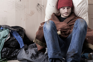 Sad man sitting on the street