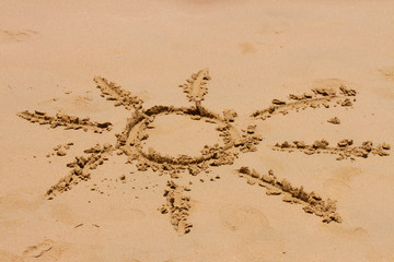 sign of sun on sand