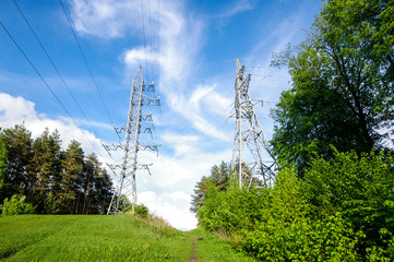 Electrification towers on the green hill horizontal