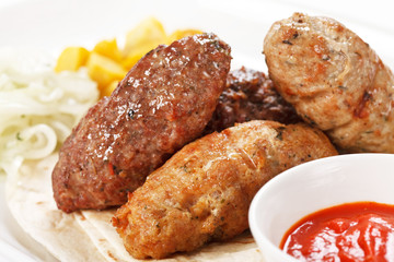 tasty cutlets with sauce and tortilla