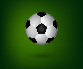Soccer ball on green background