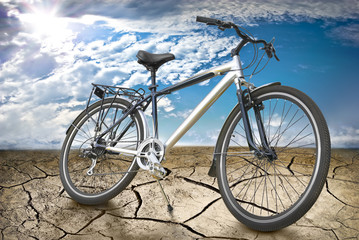 Fototapeta premium Sports bike in desert against background of Sunny sky.