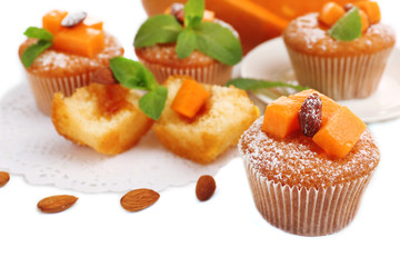 Tasty pumpkin muffins, isolated on white