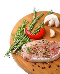 Raw meat steak with herbs and spices