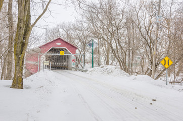 Covered Bridge in Quebec during a Snowfall