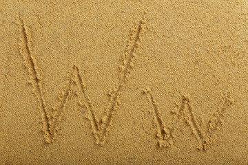 Alphabet letter written on wet beach sand