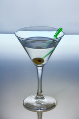 Alcohol cocktail with martini and olive
