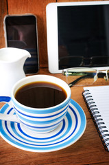 tablet pc and a coffee and Mobile phone