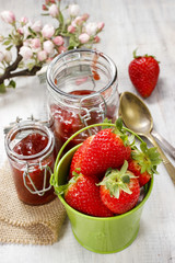 Bucket of strawberries on wooden table