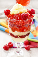 Layer fruit desserts on wooden tray. Summer garden party