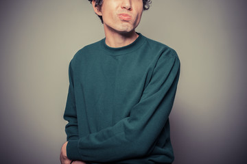 Young man pulling silly faces