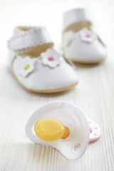 Baby pacifier and shoes
