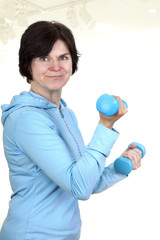 Woman with dumbbells during sport