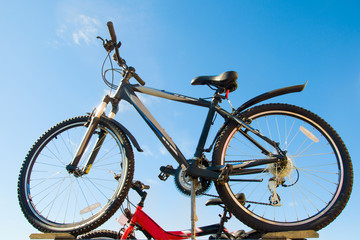 Fototapeta na wymiar bicycle on a background of blue sky