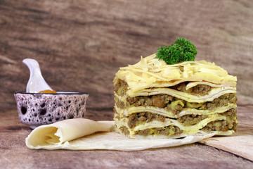 South African bobotie dish layered with pancakes