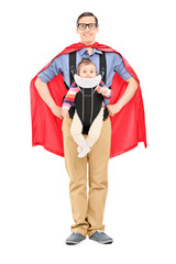 Male superhero carrying his baby daughter