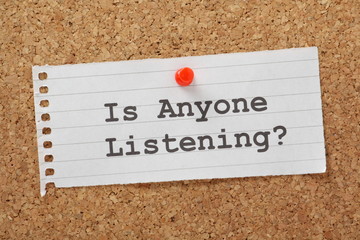 Is Anyone Listening question on a cork notice board