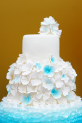 Delicious white and blue wedding cake