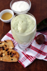 Avocado smoothie made with yogurt, milk and honey