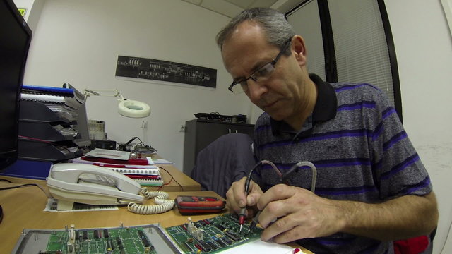 Engineer Testing A Circuit Board