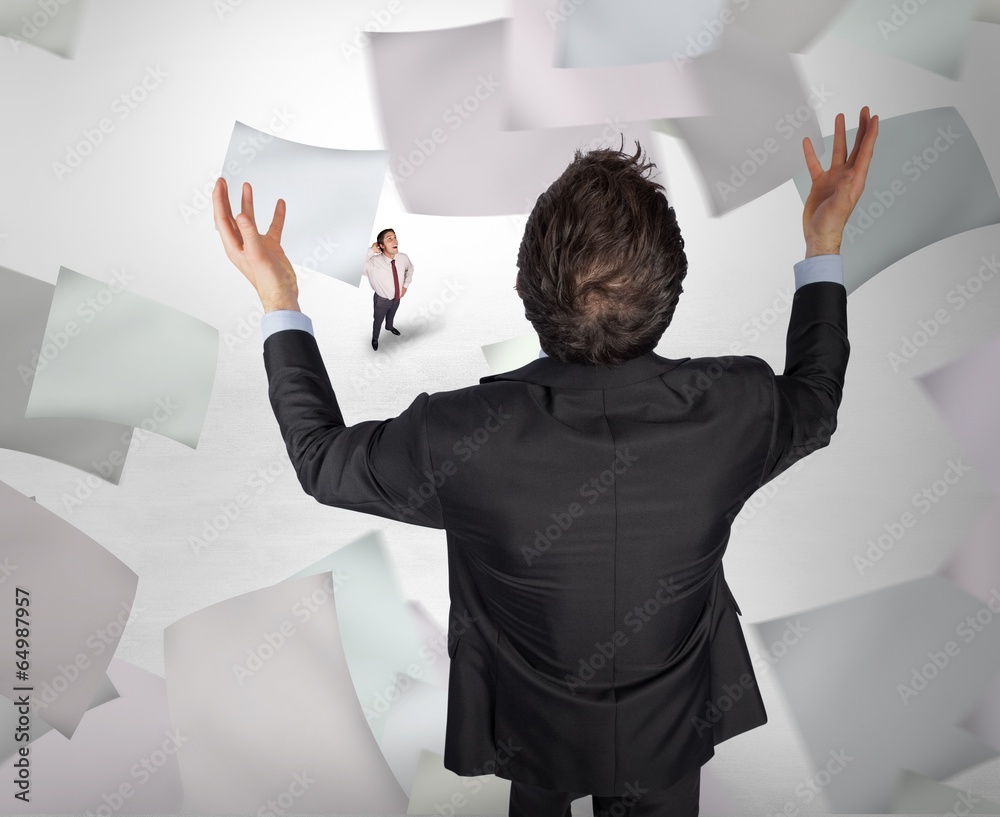 Poster Composite image of gesturing businessman with tiny businessman
