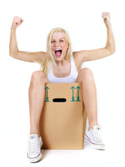 Young woman rests in her moving box and shouts