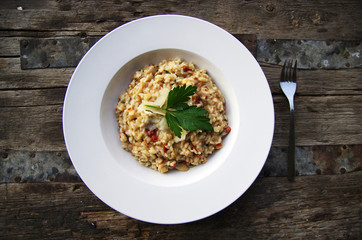 Risotto on rustic table outdoors