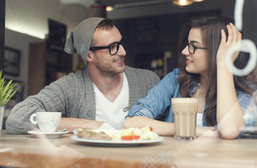 Young couple spending time together in restaurant