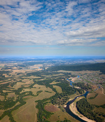 Aerial view over the river and the small village