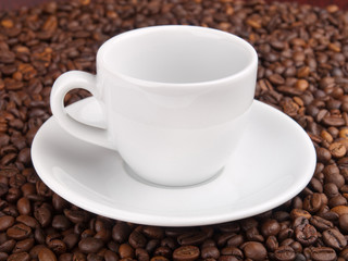 A white cup on beans background