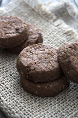 chocolate cookies over wooden background