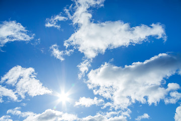 Naklejka na ściany i meble blue sky with white clouds and the sun