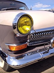 retro car with yellow headlights
