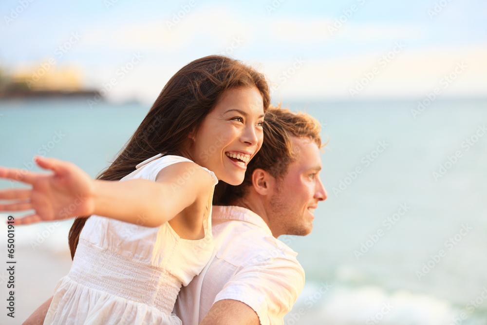 Wall mural romantic couple having fun on beach