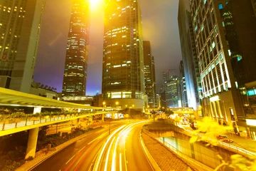 Tuinposter moving car with blur light through city at night © zhu difeng