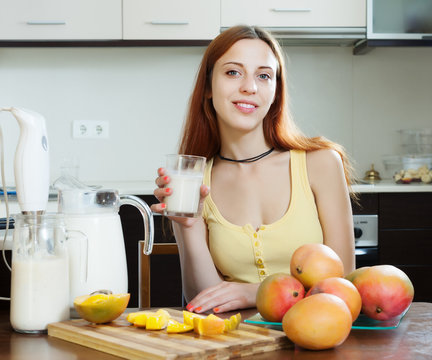  woman  drinking milk shake with mango