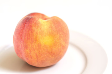 Fresh  Peach on a white plate