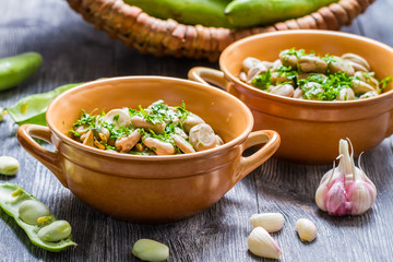 Broad beans served with parsley and garlic