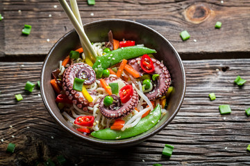 Octopus with vegetables and noodles